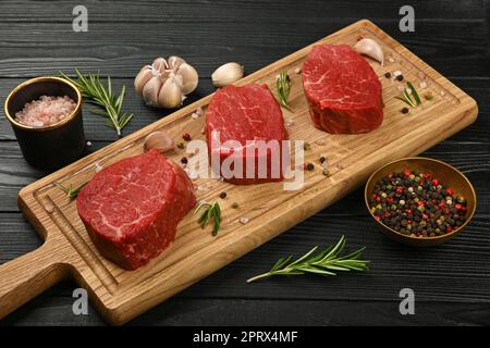 Close up raw beef tenderloin steak on board Stock Photo