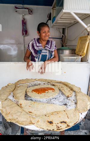 Mexico, Oaxaca, Woman making tortillas outside on traditional comal griddle  Stock Photo - Alamy