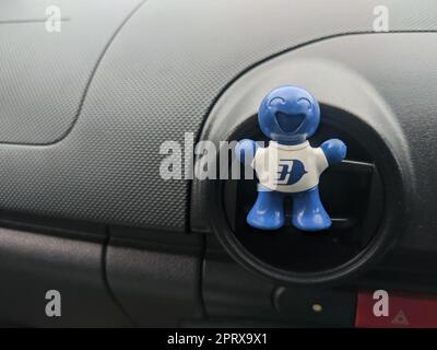 Malaysia, 17 May 2022: Car deodorant affixed to car air conditioner. Stock Photo