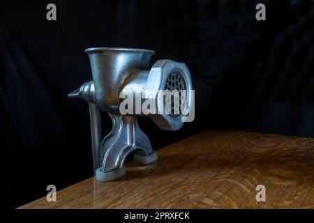 A home tool for meat processing. Kitchen items on a black background Stock Photo