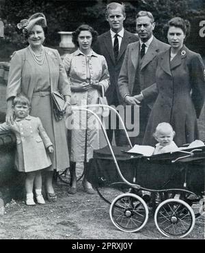 Press photograph from 1951 - informal group photoshoot of The Royal Family during a family visit to Balmoral Castle: From left to right Queen Elizabeth (mother of the late Queen Elizabeth II born Elizabeth Bowes-Lyon ) Princess Margaret, Prince Philip, Duke of Edinburgh, King George VI (1895 - 1952), and Princess Elizabeth with her children Prince Charles (aged 3) (left) - the future heir to the throne, with his sister,  Princess Anne (aged 1). This photograph marked the occasion of Princess Margaret's 21st birthday on 21st August and Princess Anne's birthday on the 15th August. Stock Photo