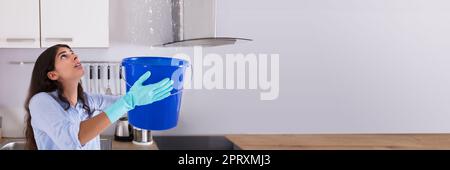Ceiling Water Leak. Woman Holding Home Damage Stock Photo - Alamy