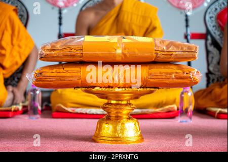 set of monk's robes placed on the pedestal Stock Photo