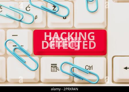 Hand writing sign Hacking Detected, Word Written on activities that seek to compromise affairs are exposed Stock Photo