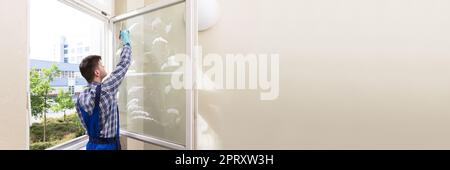 Office Window Cleaning Service. Professional Male Cleaner Stock Photo