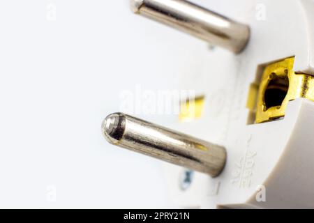 White European electric power cable with plug on light background with copy space close up. Stock Photo