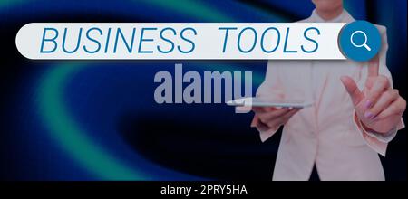 Sign displaying Business Tools, Business overview Protect the stored information safe Controlled technology Businessman in suit holding tablet symboli Stock Photo
