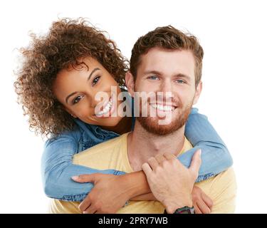 I love him to bits. Studio portrait of an affectionate young woman hugging her boyfriend against a white background Stock Photo