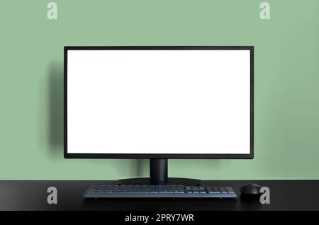 Desktop Screen Template Mockup on Green Wall Background Stock Photo