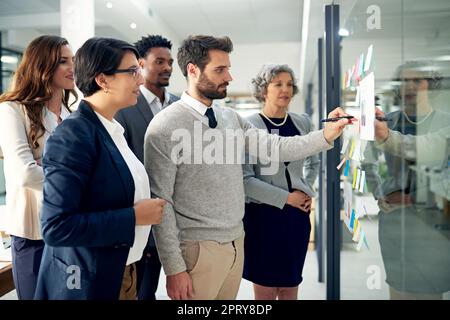 Getting down to the brass tacks. a group of businesspeople meeting in the boardroom Stock Photo