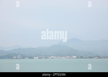 Beautiful landscape with city on shore, view from sea Stock Photo