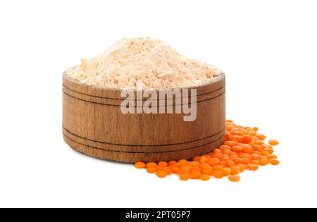 Lentil flour in wooden bowl and seeds isolated on white Stock Photo