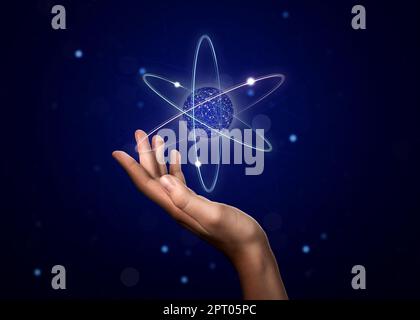 Woman demonstrating virtual model of atom on dark background, closeup Stock Photo