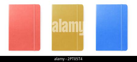 Set with multicolor notebooks on white background, top view. Banner design Stock Photo