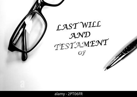 Last Will and Testament document with glasses and pen on desk for signing Stock Photo