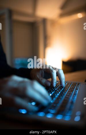 Businesswoman Typing Recent Updates On Lap Top Keyboard On Desk. Stock Photo