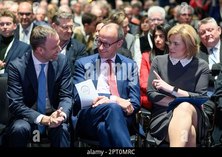 27 April 2023, Berlin: Mario Czaja (l-r), CDU Secretary General, Friedrich Merz, Chairman of the CDU, and Julia Klöckner (CDU) sit at the CDU's Future Congress at the Tempodrom. Under the motto 'Germany can do better: Strengthen the economy. Protect the climate. Germany can do better: strengthen the economy, protect the climate, create jobs', the CDU discusses with researchers and innovative companies how climate protection can be turned into an engine of renewal and growth for the economy, thus preserving jobs, prosperity and social security. Photo: Bernd von Jutrczenka/dpa Stock Photo