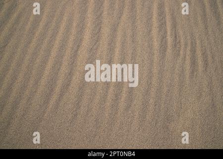 sand texture. wavy sand textured background. sand textured beach Stock Photo