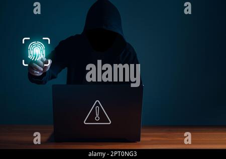 Hackers work on laptops in the dark. The concept of information security in the Internet network and information espionage. Stock Photo
