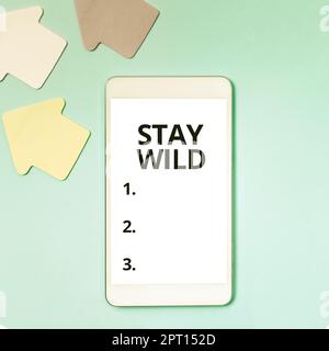 Sign displaying Stay Wild. Concept meaning keep being you and