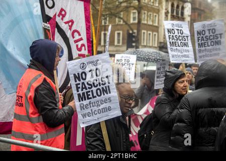 London, UK. 27th Apr, 2023. As the far-right leader of Italy, Giorgia Meloni, visits Number 10 to meet with Rishi Sunak, she praises Sunak's Illegal Immigration Bill. Meanwhile, a group of Italians and Britons gather outside Number 10 to protest, chanting 'No to fascist Meloni' and 'Refugees welcome here.' Credit: Sinai Noor/Alamy Live News Stock Photo