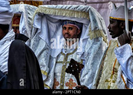 Gondar, Ethiopia - January 18, 2018: Orthodox priests carry a tabot, a model of the Ark of the Covenant, in a procession for the annual Timka festival. Stock Photo
