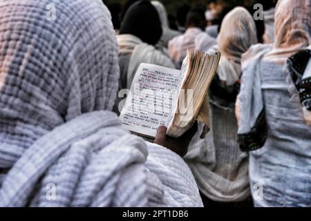 Gondar, Ethiopia - January 19, 2018: Women praying in the Fasilides Bath at the annual Timkat festival, an Orthodox Christian celebration in Ethiopia Stock Photo