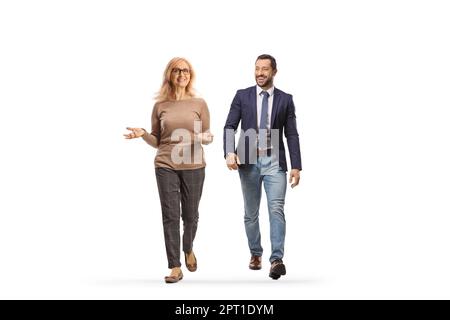 Mature woman walking and smiling with a younger man isolated on white background Stock Photo
