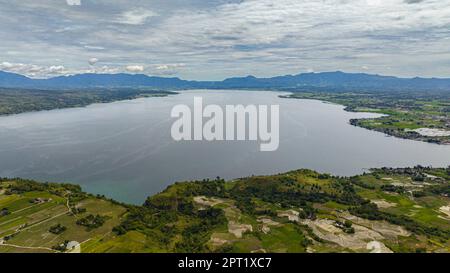 Aerial view of rice fields and farmland on the shores of Lake Toba. Sumatra, Indonesia. Stock Photo