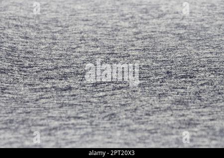 Real heather knitted fabric made of synthetic fibres textured background. Colored fabric texture. Background with delicate striped pattern Stock Photo