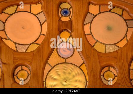 Stained glass window of the access door to the main room of the noble floor of Casa Batlló designed by Antoni Gaudí (Barcelona, Catalonia, Spain) Stock Photo
