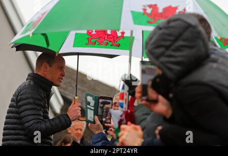 The Prince of Wales talks with well wishers during a visit to Dowlais Rugby Club, near Merthyr Tydfil in Wales. The volunteer-run organisation, which covers the central area of the Bannau Brycheiniog National Park including Pen y Fan, is celebrating its 60th birthday. Picture date: Thursday April 27, 2023. Stock Photo