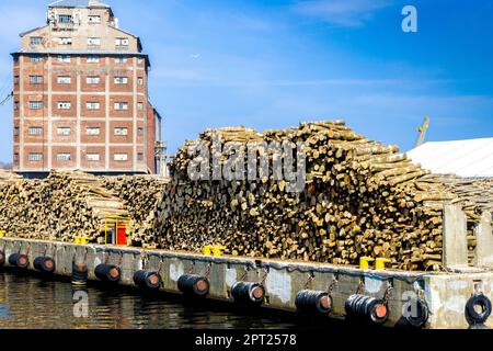 A stack of wood in a port Stock Photo