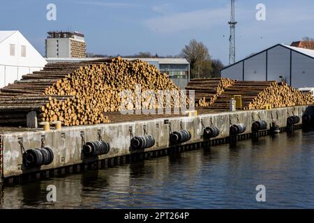 A stack of wood in a port Stock Photo