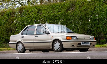 Bicester,Oxon,UK - April 23rd 2023. 1989 Nissan Sunny travelling on an English country road. Stock Photo