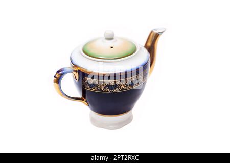 Old-fashioned beautiful gilded porcelain teapot on a white background Stock Photo