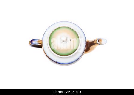 Old-fashioned beautiful gilded porcelain teapot on a white background Stock Photo