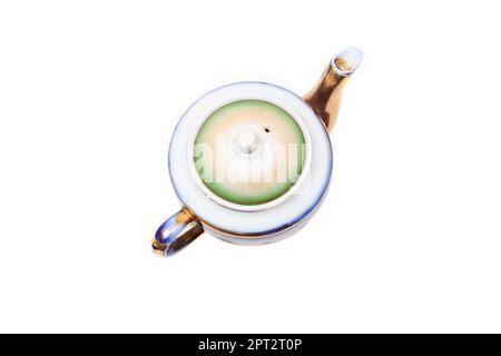 Old-fashioned beautiful gilded porcelain teapot on a white background, from above Stock Photo