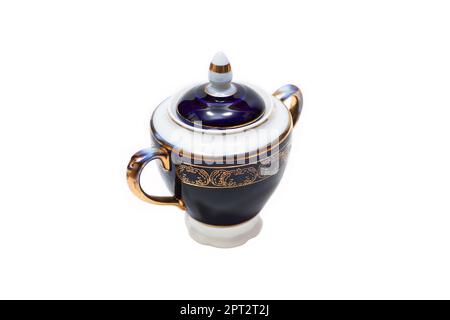 Old-fashioned beautiful gilded porcelain sugar bowl on a white background Stock Photo