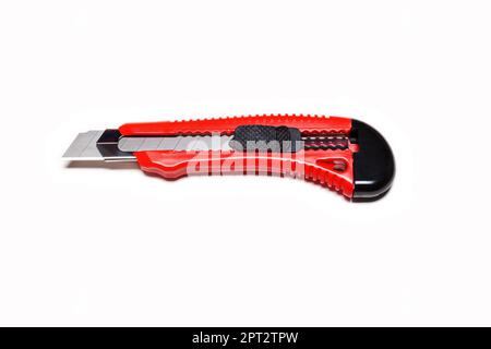 Red clerical knife on a white background Stock Photo