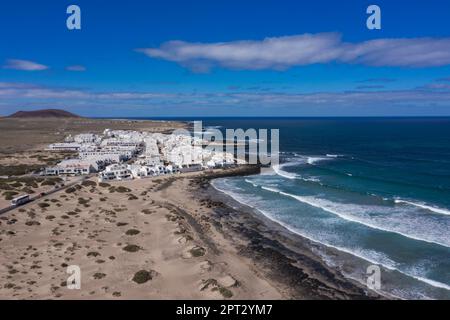 Landscape panorama of La Caleta de Famara and fire mountain, Lanzarote, Lanzarote, the Canary islands, Spain Stock Photo