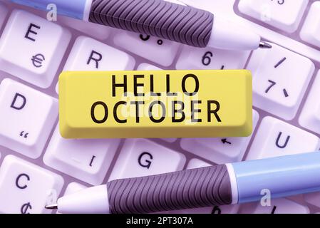 Sign displaying Hello October, Word Written on greeting used when welcoming the 10th month of the year Stock Photo