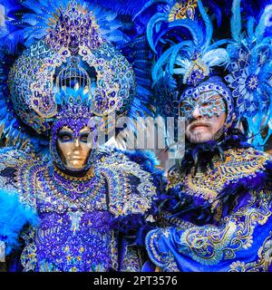 Venice Carnivale, two participants in turquoise blue Venetian baroque peacock inspired costume with feathers, mask and hat, Venezia, Italy Credit: Imageplotter/Alamy Live News Stock Photo