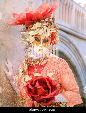 Venice Carnival, costumed female participant in colourful fancy dress, hat and mask poses, Venice Italy, Credit: Imageplotter/Alamy Live News Stock Photo