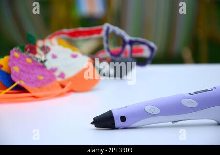 3d handle pen and 3d painting figures. Concept of andmade STEM education - New toy for child to Play and study at school and home Stock Photo