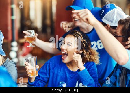 Young supporters cheering in a bar Stock Photo - Alamy