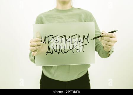 Handwriting text Upstream Analyst, Internet Concept process of determining the current worth of an asset Businessman Holding Pen, Pointing On Graph An Stock Photo