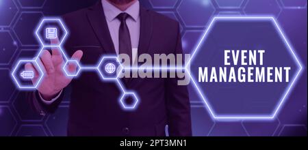 Inspiration showing sign Event Management, Business concept everything that happens is part of a bigger picture Businessman Pointing On Floppy Disk Di Stock Photo