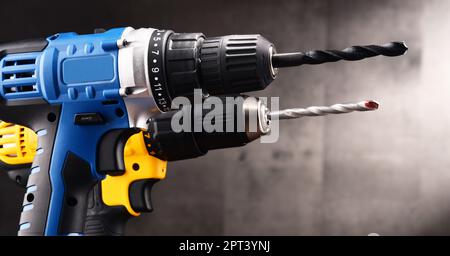 Two cordless drills with drill bits working also as screw guns. Stock Photo