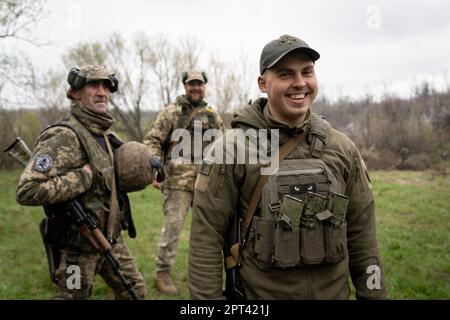 Mykta, 23 (R), a Ukrainian soldier from the 17th tank brigade is seen reacting in the artillery position. He voluntarily joined the army since last summer in the hopes to end the war. Ukrainian armed force is fighting intensely in Bakhmut and the surrounding area as Russian forces are getting ever closer to taking the eastern city of Ukraine. The battle of Bakhmut is now known as “the bloodiest” and “one of the longest fight”, it has become one of the most significant fights in the war between Ukraine and Russia. (Photo by Ashley Chan/SOPA Images/Sipa USA) Stock Photo